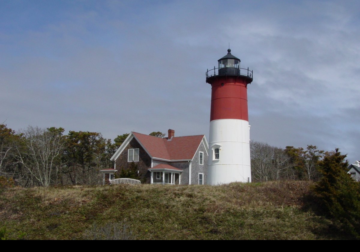 The lighthouse was moved to Eastham in 1923 to replace the "Three Sisters of Nauset". These are preserved on a nearby clearing, and there are pictures in this slideshow.