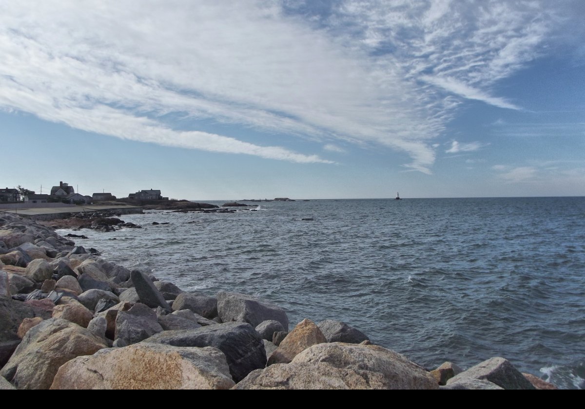 Looking south from the car park towards the lighthouse. The houses on the left are along Rohde Island Road, and have magnificent views across the Sakonnet River towards Newport; and the lighthouse, of course!
