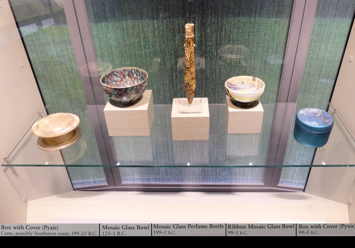 "Pyxis" is a piece of ancient Greek pottery, often cylindrical with a separate lid.  Used, for example, to hold cosmetics, jewellery or trinkets.