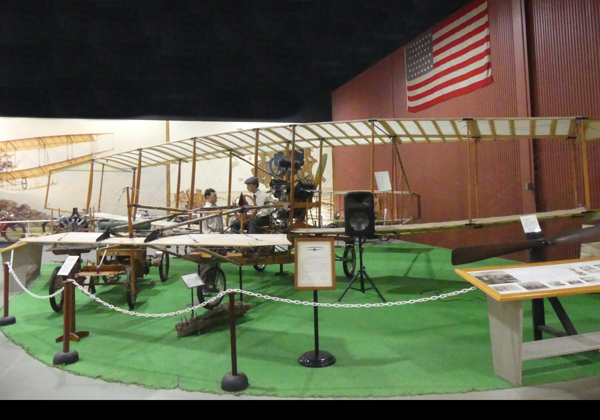 The "June Bug" 1908.  Designed by Curtiss the "June Bug" became the first aircraft to fly a distance of one kilometer. On July 4, 1908, Glenn Curtiss piloted the "June Bug" on the flight that was to win for him the Scientific American Trophy and the ultimate honor of being awarded U.S.Pilot's License No.1. The museum's reproduction was built by volunteers and was flown successfully in 1976.